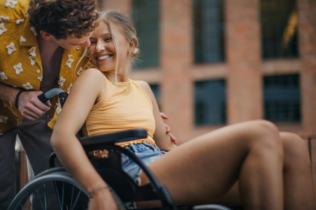 Beautiful gen Z girl in a wheelchair with her boyfriend.